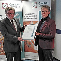 To celebrate 25 years of Compass Software, Chamber of Commerce representative Mrs. Preiss, awarded CEO Detlef Hollinderbaeumer with an honorary certificate to commemorate the company’s anniversary.